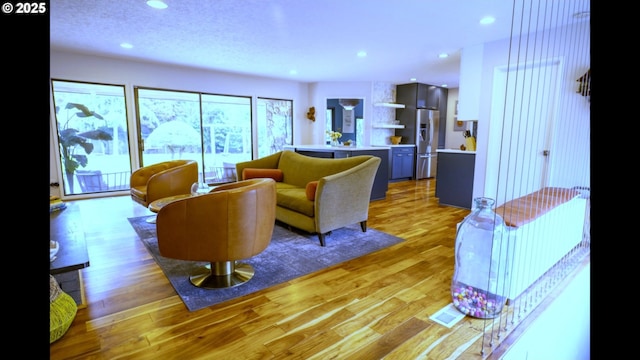 2280 NW 5th St, Gresham, OR 97030 - living room with recessed lighting, light wood-type flooring, and visible vents