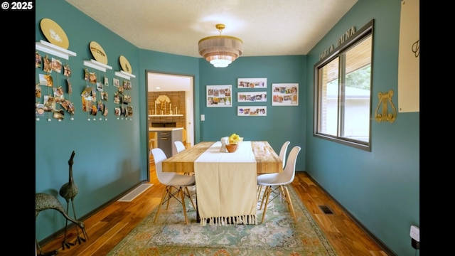 2280 NW 5th St, Gresham, OR 97030 - dining room with visible vents, a textured ceiling, and wood finished floors