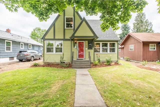 1180 16th St NE, Salem, OR 97301 - english style home with a front yard and roof with shingles