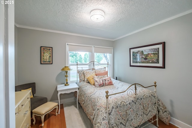 1180 16th St NE, Salem, OR 97301 - bedroom with a textured ceiling, wood finished floors, and crown molding