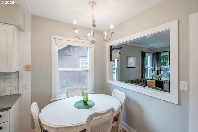 1180 16th St NE, Salem, OR 97301 - dining room featuring a chandelier