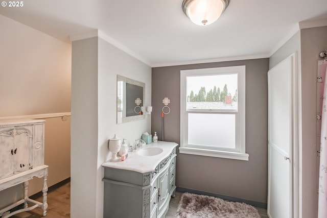 1180 16th St NE, Salem, OR 97301 - bathroom with vanity, crown molding, and wood finished floors