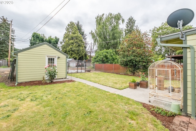 1180 16th St NE, Salem, OR 97301 - fenced backyard with a patio area and an outdoor structure