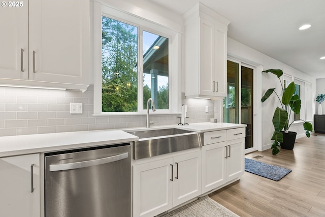 15955 SE Cherry Blossom Way, Happy Valley, OR 97015 - kitchen with stainless steel dishwasher, light countertops, white cabinets, backsplash, and recessed lighting