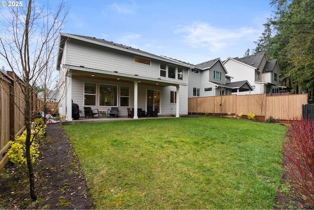 15955 SE Cherry Blossom Way, Happy Valley, OR 97015 - rear view of house with a fenced backyard and a patio