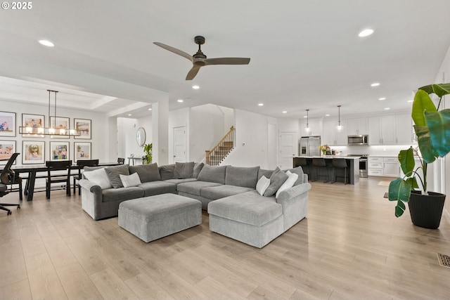 15955 SE Cherry Blossom Way, Happy Valley, OR 97015 - living area with recessed lighting, light wood-type flooring, ceiling fan, and stairway