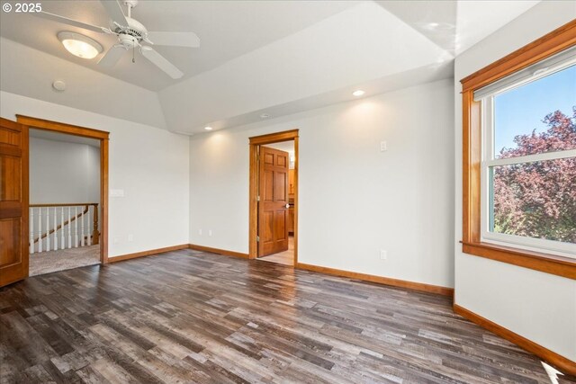 spare room with wood finished floors, baseboards, recessed lighting, a ceiling fan, and vaulted ceiling