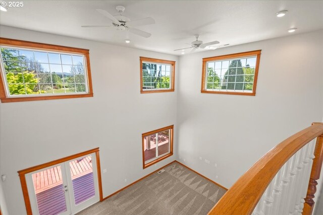 carpeted entrance foyer featuring baseboards, recessed lighting, and a ceiling fan