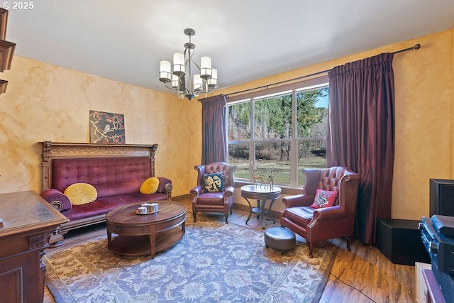sitting room featuring wood finished floors and a chandelier