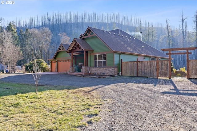 view of front facade with a garage and a front lawn