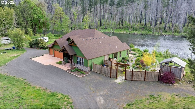 49164 Mckenzie Hwy, Vida, OR 97488 - craftsman-style house with an attached garage, stone siding, and dirt driveway