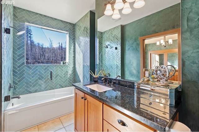 bathroom featuring a chandelier, a tub, tile patterned flooring, vanity, and a shower