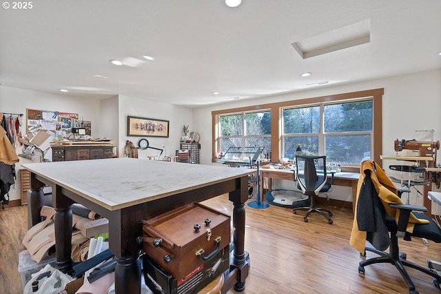 office featuring recessed lighting, light wood-style flooring, and attic access