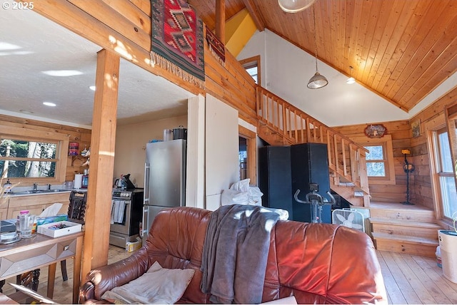 living room featuring stairs, wood walls, hardwood / wood-style floors, recessed lighting, and wooden ceiling