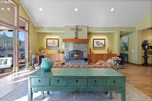 49164 Mckenzie Hwy, Vida, OR 97488 - living room with wood finished floors, a stone fireplace, baseboards, high vaulted ceiling, and recessed lighting