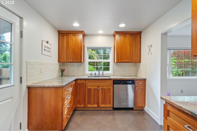 5239 Madrona St, Lake Oswego, OR 97035 - kitchen with stainless steel dishwasher, decorative backsplash, light stone countertops, brown cabinetry, and recessed lighting