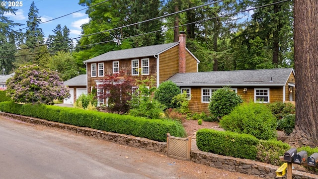 5239 Madrona St, Lake Oswego, OR 97035 - view of front of property featuring a shingled roof, a chimney, and an attached garage
