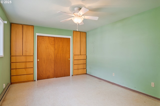 3111 Lindsey Dr, Longview, WA 98632 - unfurnished bedroom featuring a baseboard heating unit, a closet, and a ceiling fan