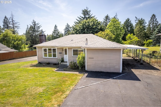 3111 Lindsey Dr, Longview, WA 98632 - view of front of property with asphalt driveway, a chimney, an attached carport, and roof with shingles