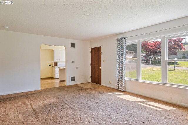 3111 Lindsey Dr, Longview, WA 98632 - unfurnished room featuring light carpet, a textured ceiling, and a smoke detector