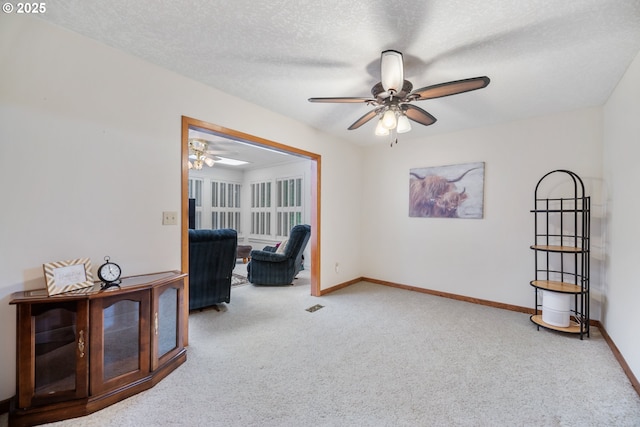 14000 NE 97th Ave, Vancouver, WA 98662 - living area featuring a ceiling fan, carpet, baseboards, and a textured ceiling