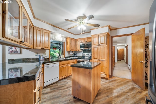 14000 NE 97th Ave, Vancouver, WA 98662 - kitchen with appliances with stainless steel finishes, a sink, light wood finished floors, ceiling fan, and glass insert cabinets