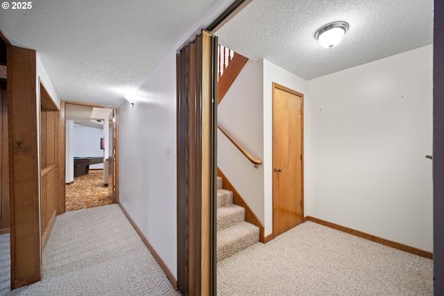 14000 NE 97th Ave, Vancouver, WA 98662 - corridor featuring a textured ceiling, light colored carpet, stairway, and baseboards