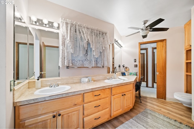 14000 NE 97th Ave, Vancouver, WA 98662 - full bathroom featuring wood finished floors, double vanity, toilet, and ceiling fan
