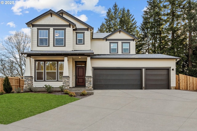 craftsman-style house with a garage and a front yard