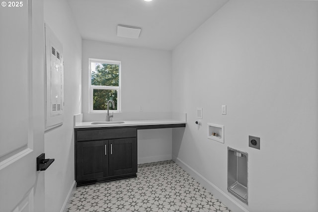 washroom with gas dryer hookup, sink, cabinets, washer hookup, and hookup for an electric dryer