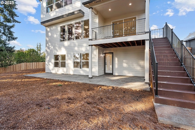 back of property featuring a patio