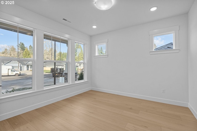 spare room featuring light wood-type flooring