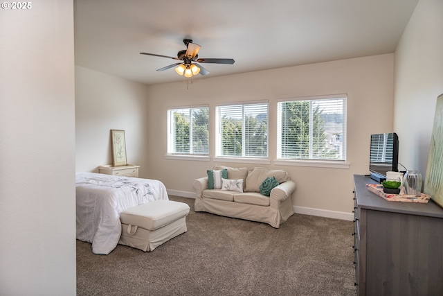 bedroom featuring multiple windows, baseboards, carpet, and a ceiling fan