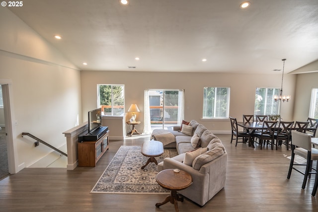 living room with dark wood finished floors, lofted ceiling, and plenty of natural light