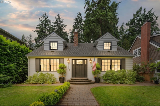 630 9th St, Lake Oswego, OR 97034 - cape cod house featuring a lawn, a chimney, and a shingled roof