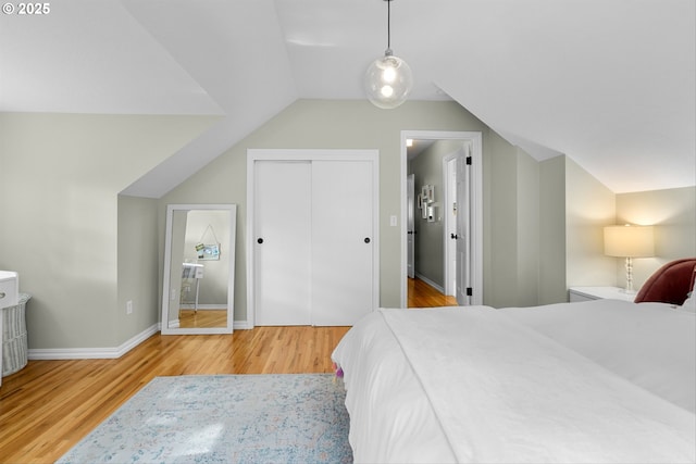 630 9th St, Lake Oswego, OR 97034 - bedroom with wood finished floors, lofted ceiling, and a closet