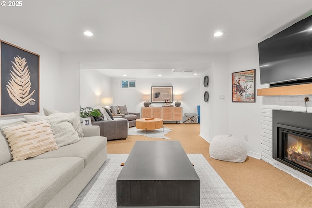 630 9th St, Lake Oswego, OR 97034 - living room with a brick fireplace, recessed lighting, and light carpet