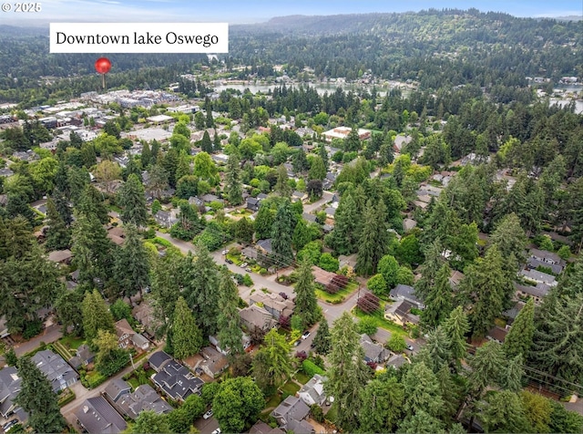 630 9th St, Lake Oswego, OR 97034 - aerial overview of property's location with nearby suburban area and a heavily wooded area