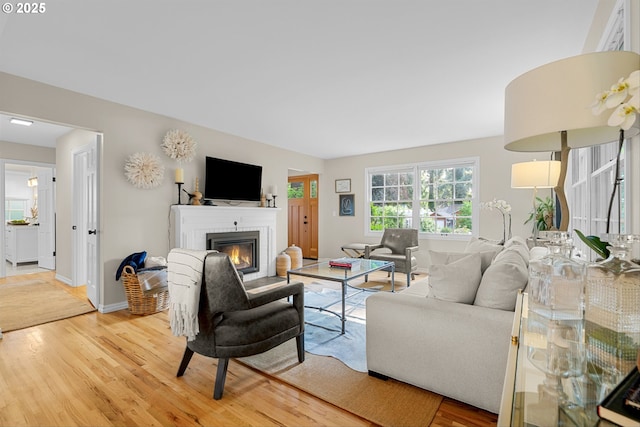 630 9th St, Lake Oswego, OR 97034 - living area featuring light wood-style floors and a fireplace