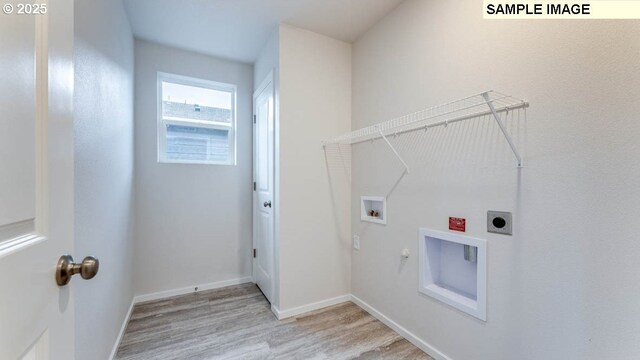 laundry room featuring electric dryer hookup, washer hookup, light hardwood / wood-style flooring, and hookup for a gas dryer