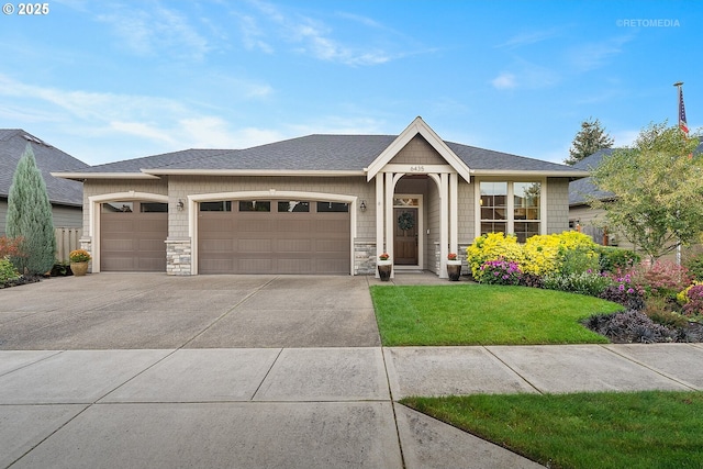 6435 SE Ketchum St, Milwaukie, OR 97267 - ranch-style house with stone siding, an attached garage, concrete driveway, and a front yard