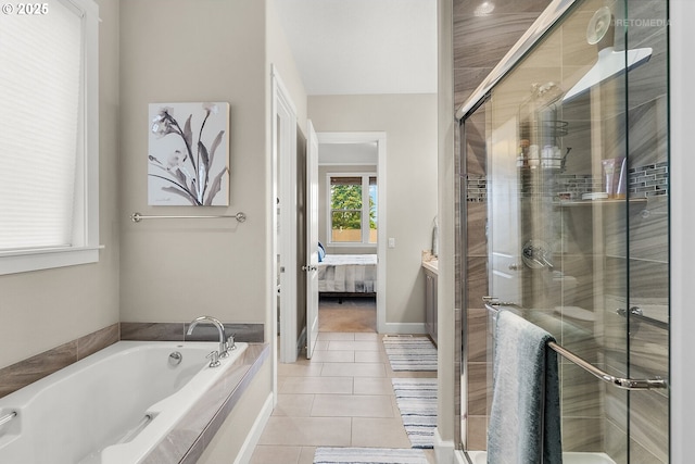 6435 SE Ketchum St, Milwaukie, OR 97267 - ensuite bathroom featuring tile patterned floors, a garden tub, a shower stall, and vanity