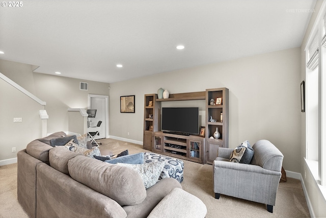6435 SE Ketchum St, Milwaukie, OR 97267 - living room featuring light colored carpet, baseboards, recessed lighting, and stairs