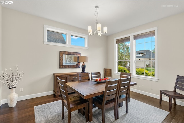 6435 SE Ketchum St, Milwaukie, OR 97267 - dining space featuring a chandelier, baseboards, and dark wood-style flooring
