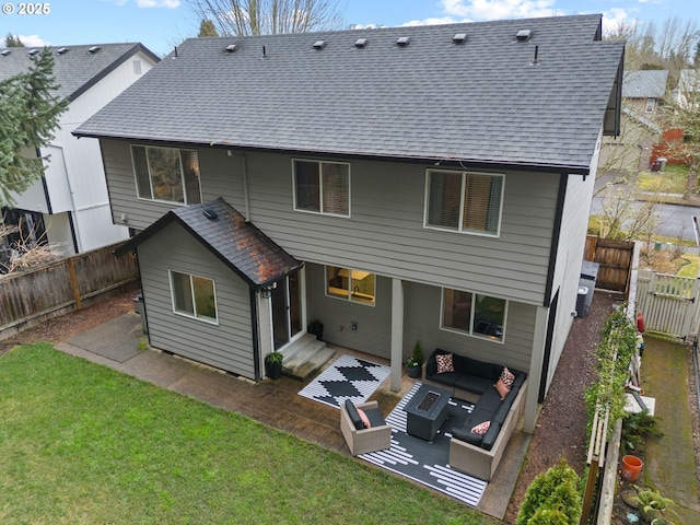 back of house featuring a yard, roof with shingles, a patio, and fence