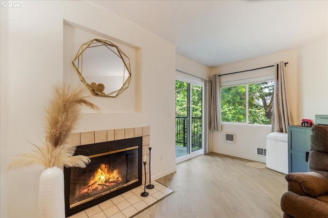 8720 SW Tualatin Rd Unit 204, Tualatin, OR 97062 - living room with wood finished floors and a tile fireplace