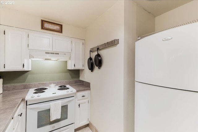 8720 SW Tualatin Rd Unit 204, Tualatin, OR 97062 - kitchen featuring white appliances, under cabinet range hood, and white cabinetry