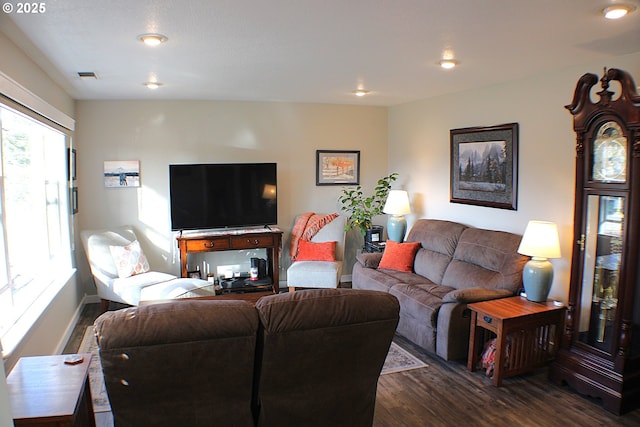 living room with recessed lighting, visible vents, baseboards, and dark wood-type flooring