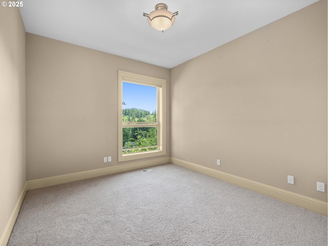 empty room featuring carpet flooring