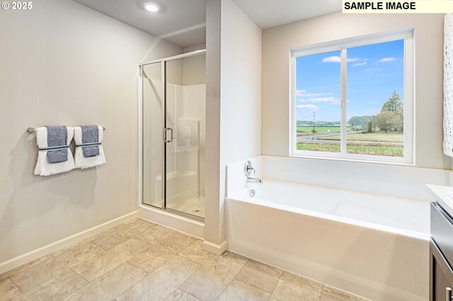 23623 SW Landon Pl, Tualatin, OR 97062 - full bathroom with a shower stall, vanity, a garden tub, and baseboards